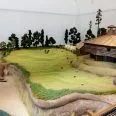 a model of a building and a barn